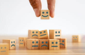 blocks-with-smiley-faces-being-stacked