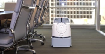 Whiz-commercial-robot-vacuum-on-office-carpet